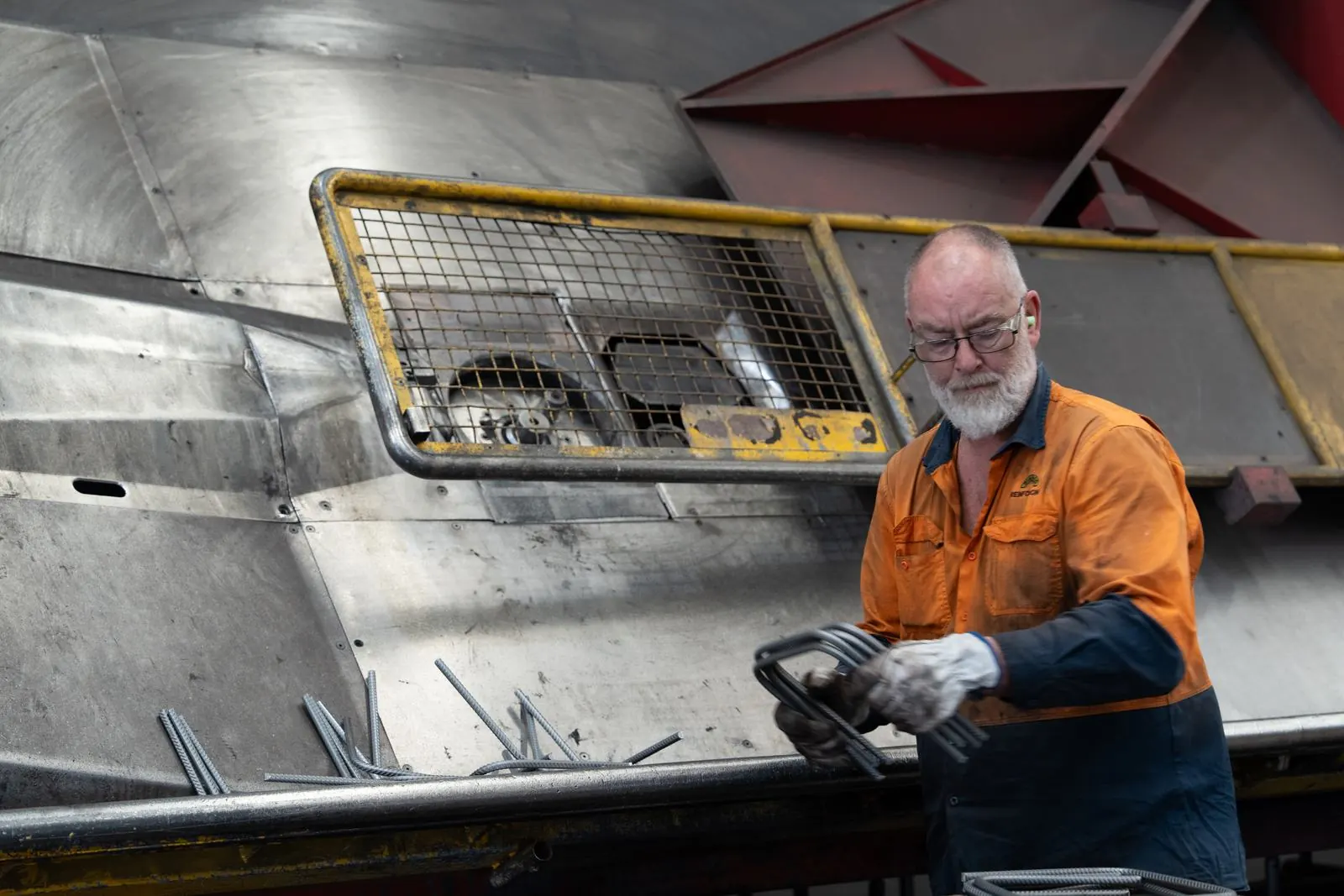 Bianco worker operating a bar bending machine